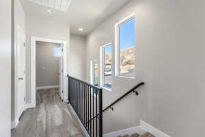 Staircase featuring wood-type flooring