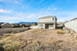 Rear view of property with a mountain view