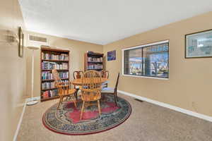 Dining room with a textured ceiling