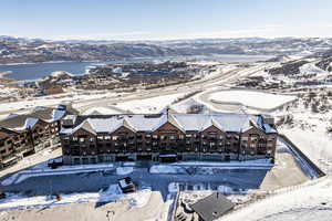 Snowy aerial view featuring a mountain view