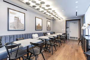 Dining room featuring crown molding and hardwood / wood-style floors