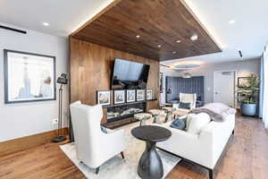 Living room with hardwood / wood-style floors and wooden ceiling