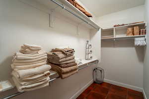 View of primary suite's walk-in closet