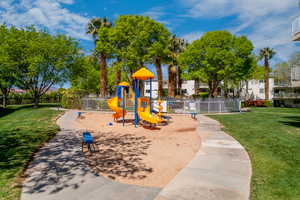 View of play area with a yard