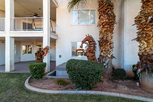 Rear Patio area with large sculptures and Hot tub