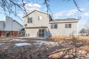 Back of property with a patio