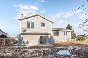 Rear view of house featuring a patio