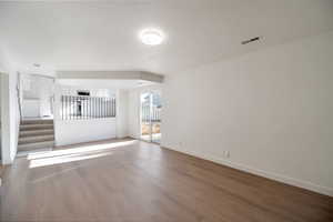 Empty room featuring hardwood / wood-style flooring