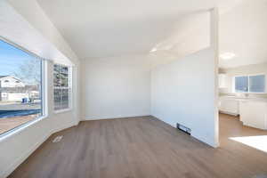 Empty room featuring sink and light hardwood / wood-style floors