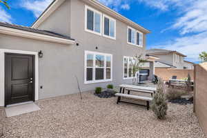 Rear view of property with a patio