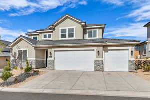 View of front of property with a garage