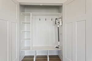 Mudroom with dark hardwood / wood-style floors