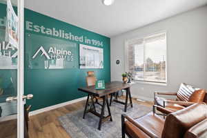 Office area featuring hardwood / wood-style flooring