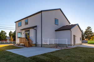 Back of house featuring a patio and a lawn