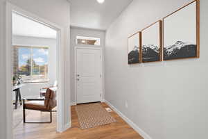 Entryway with light hardwood / wood-style floors