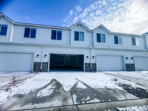 View of property with a garage