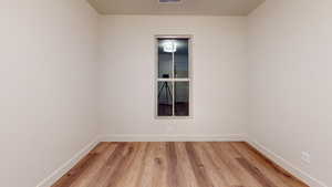 Empty room featuring light wood-type flooring