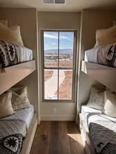 Bedroom featuring a mountain view and hardwood / wood-style floors