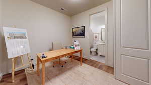 Home office featuring light hardwood / wood-style floors