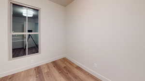 Spare room with wood-type flooring