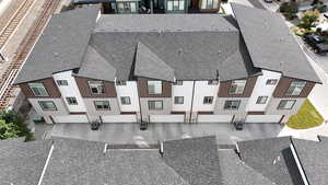 Rear view of subject property showing garages