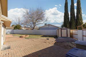 View of patio / terrace featuring a shed