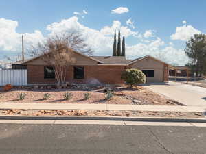 View of front facade with a carport