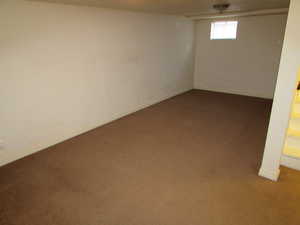 Basement with carpet flooring