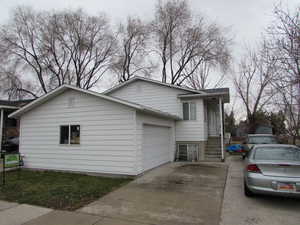 View of side of property featuring a garage