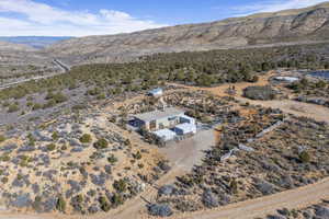 Birds eye view of property with a mountain view