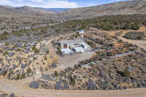 Birds eye view of property with a mountain view