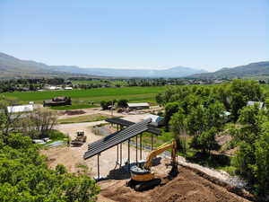 View of mountain backdrop featuring rural landscape