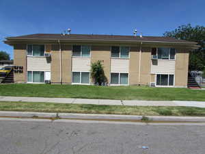 View of property with cooling unit