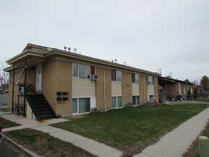 View of property featuring central air condition unit