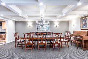 Dining space with carpet, coffered ceiling, and beam ceiling