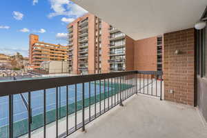 Balcony with tennis court view