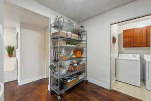 Kitchen storage wall with adjacent access to the laundry area.