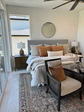 Carpeted bedroom featuring ceiling fan