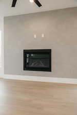 Details featuring wood-type flooring and ceiling fan