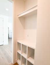 Mudroom featuring light hardwood / wood-style floors and a textured ceiling