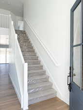 Stairs with hardwood / wood-style floors