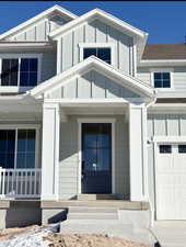 Entrance to property featuring a garage