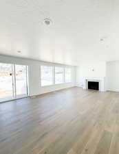 Unfurnished living room featuring light wood-type flooring