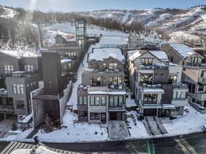 Snowy aerial view with a mountain view