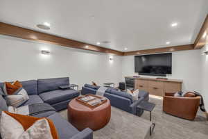 Living room with wine cooler and light colored carpet