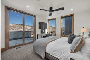 Bedroom featuring light carpet, access to outside, and ceiling fan