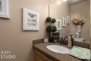 Bathroom featuring vanity and toilet