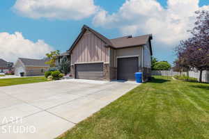 Exterior space with a yard and a garage