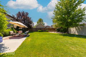 View of yard featuring an outdoor living space and a patio area