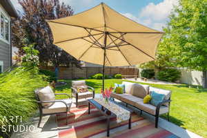 Wooden deck with an outdoor living space and a yard